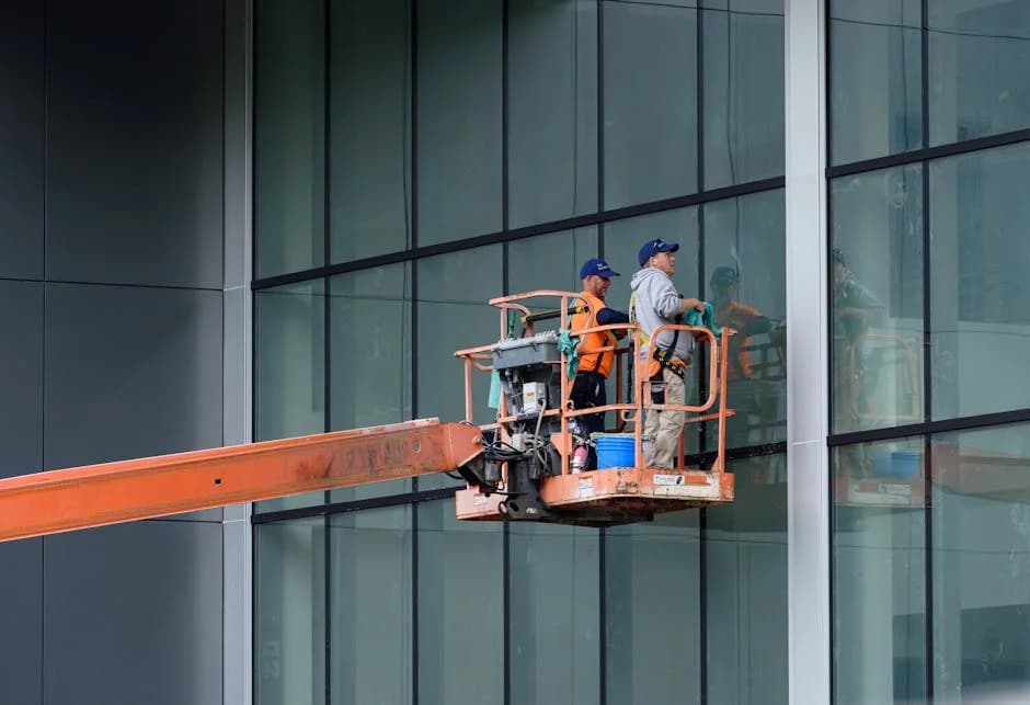 Commercial cleaning crew performing detailed cleaning of overlooked areas in a facility
