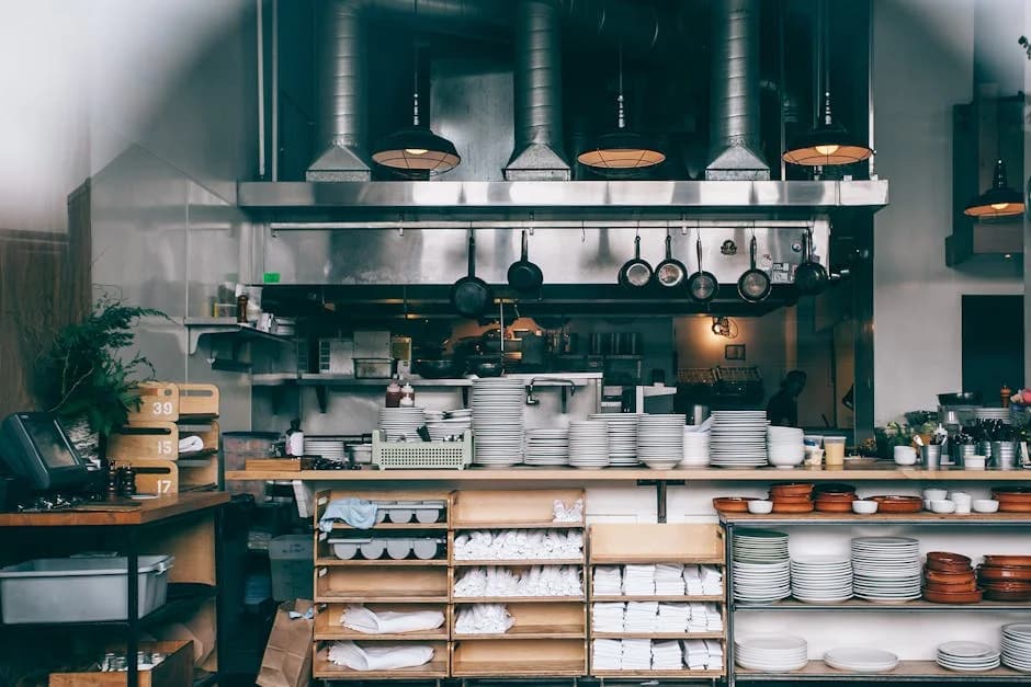 Professional cleaning crew maintaining a commercial restaurant kitchen