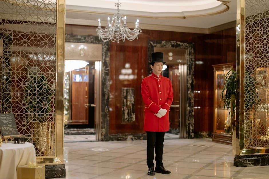 Professional day porter maintaining a commercial lobby during business hours
