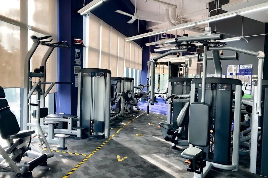 Fitness facility being professionally cleaned with commercial equipment