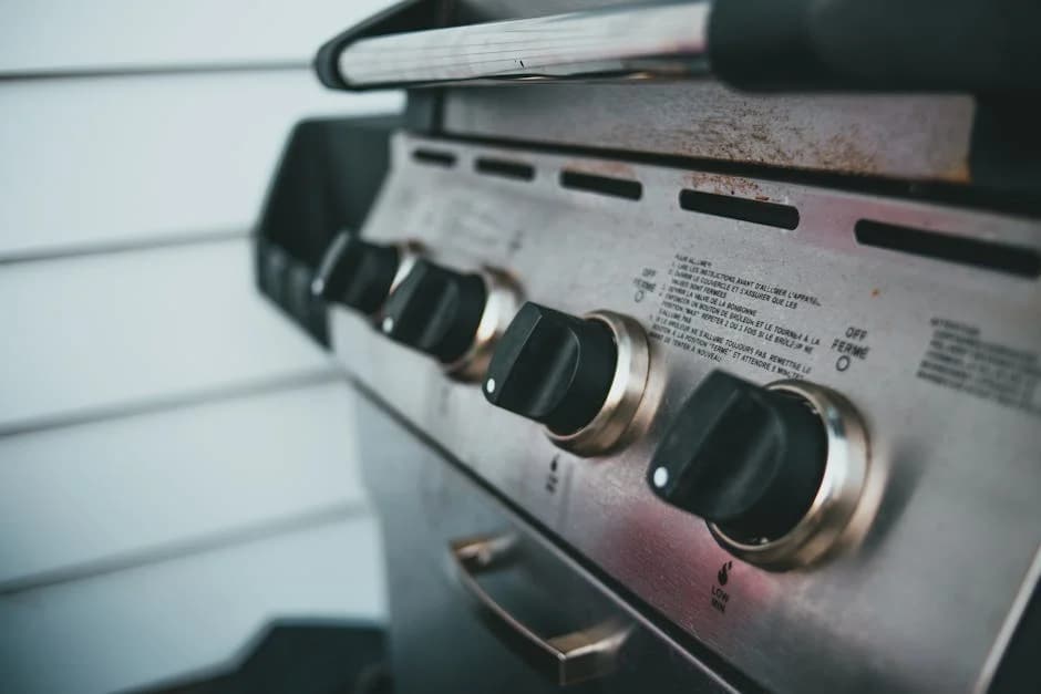 Professional cleaning staff deep cleaning commercial kitchen equipment in a restaurant