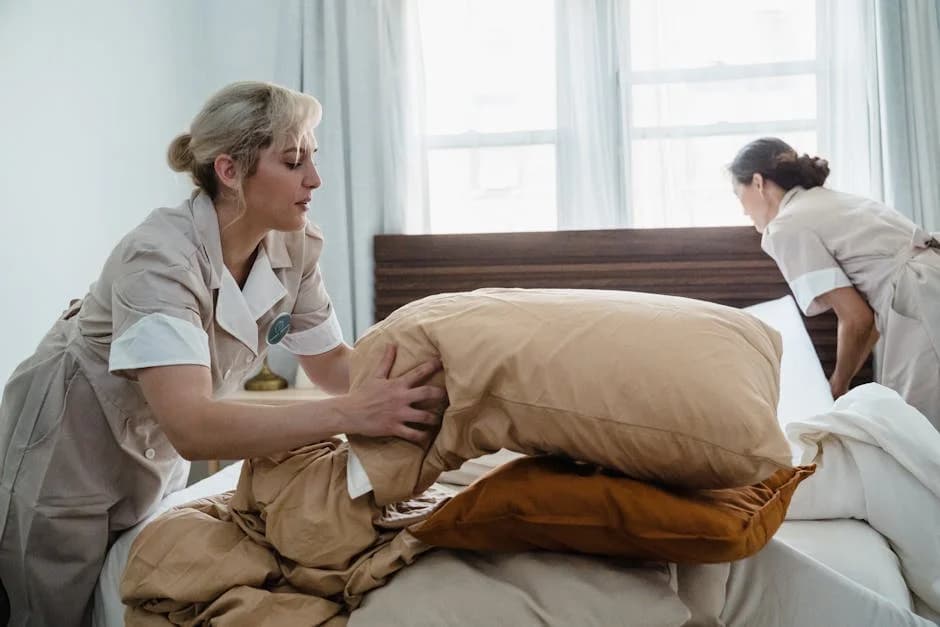 Hotel cleaning staff maintaining common areas and guest rooms during high occupancy