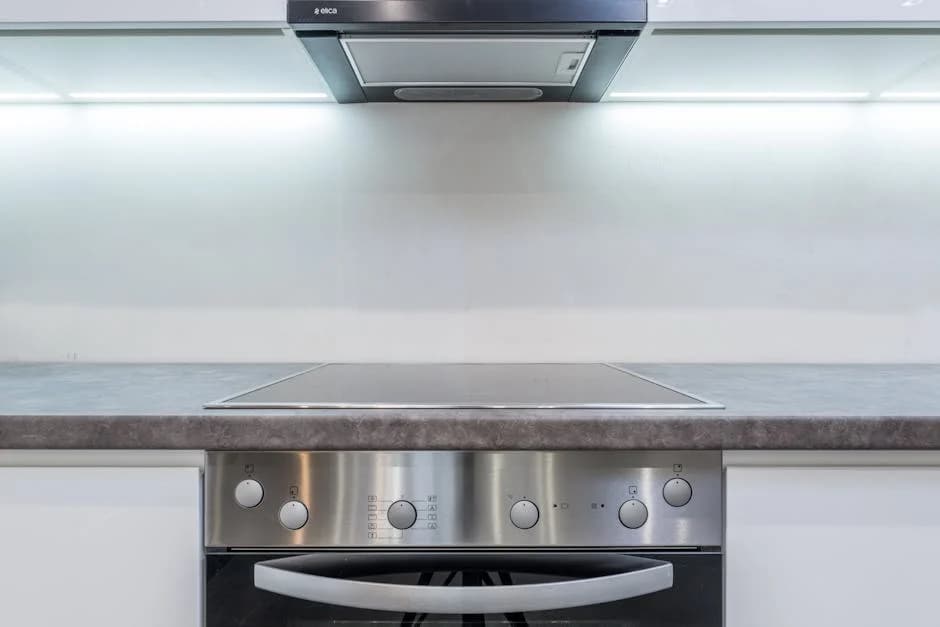 Commercial kitchen being professionally cleaned with industrial equipment and proper techniques