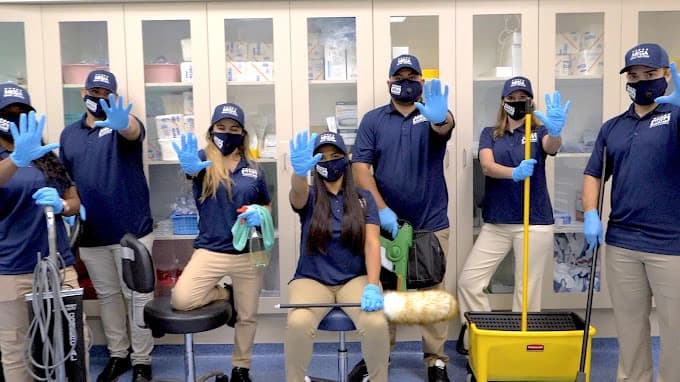 Mega Service Solutions cleaning team in Tampa — bonded, insured, background-checked professionals in uniform